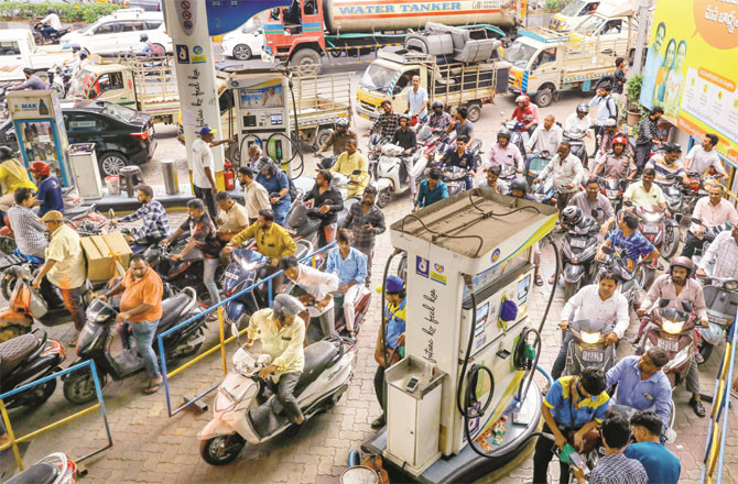 Long queues formed at petrol pumps to fill up vehicles` tanks on Wednesday