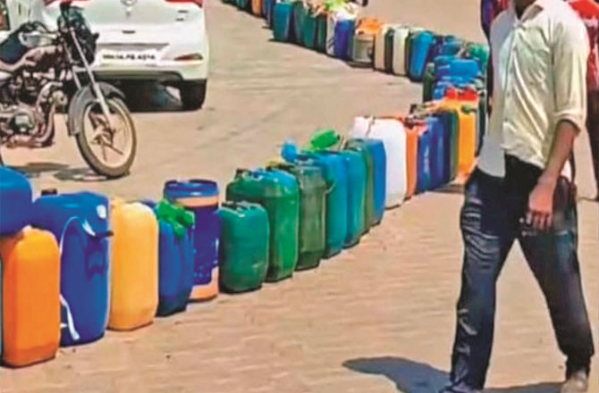 This is not a queue for water in a trick, but a queue at the pump for petrol and diesel.