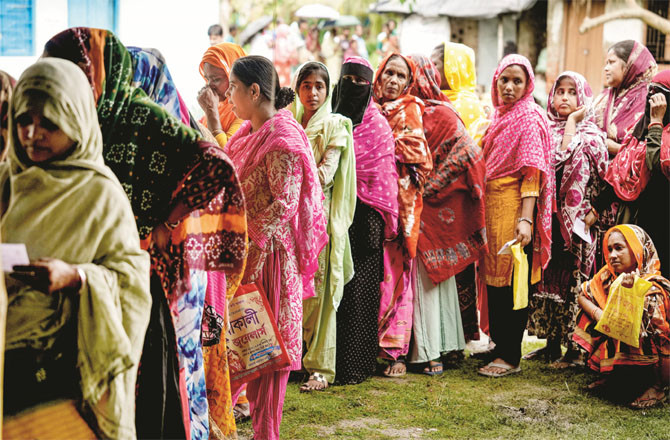 A queue of women voters can be seen at a polling booth in South 24 Parganas.