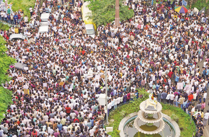 Participants in a protest outside the Pune District Collector`s office can be seen in a photograph taken from a high-rise building. Picture: PTI 