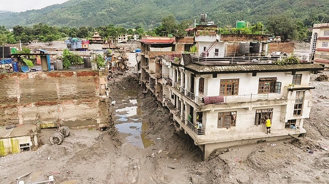 Debris brought by floodwaters has settled in several villages across Nepal. Picture: PTI